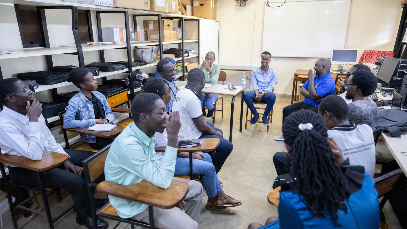 Photo of Abdirahman Mohamud Kulane speaks during a meeting with visually impaired students from KyU in Kampala, Uganda.