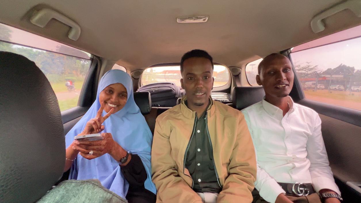 A photo of members of UDHAN team in a car arrive at Kampala to participate in a week-long training on braille production and digital inclusion.