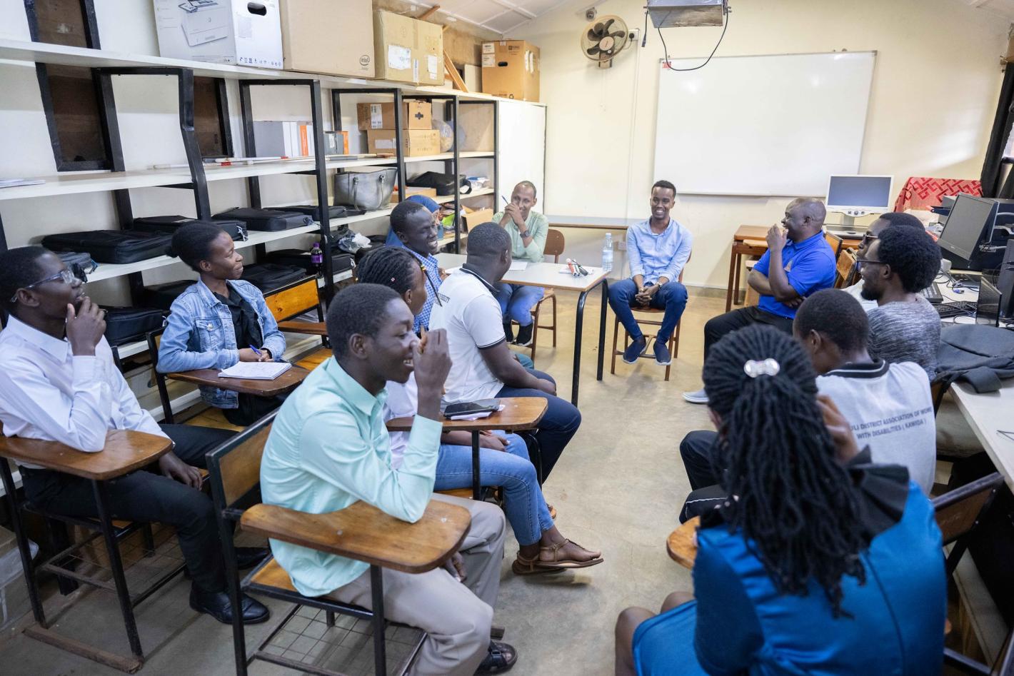 Photo of Abdirahman Mohamud Kulane speaks during a meeting with visually impaired students from KyU in Kampala, Uganda.