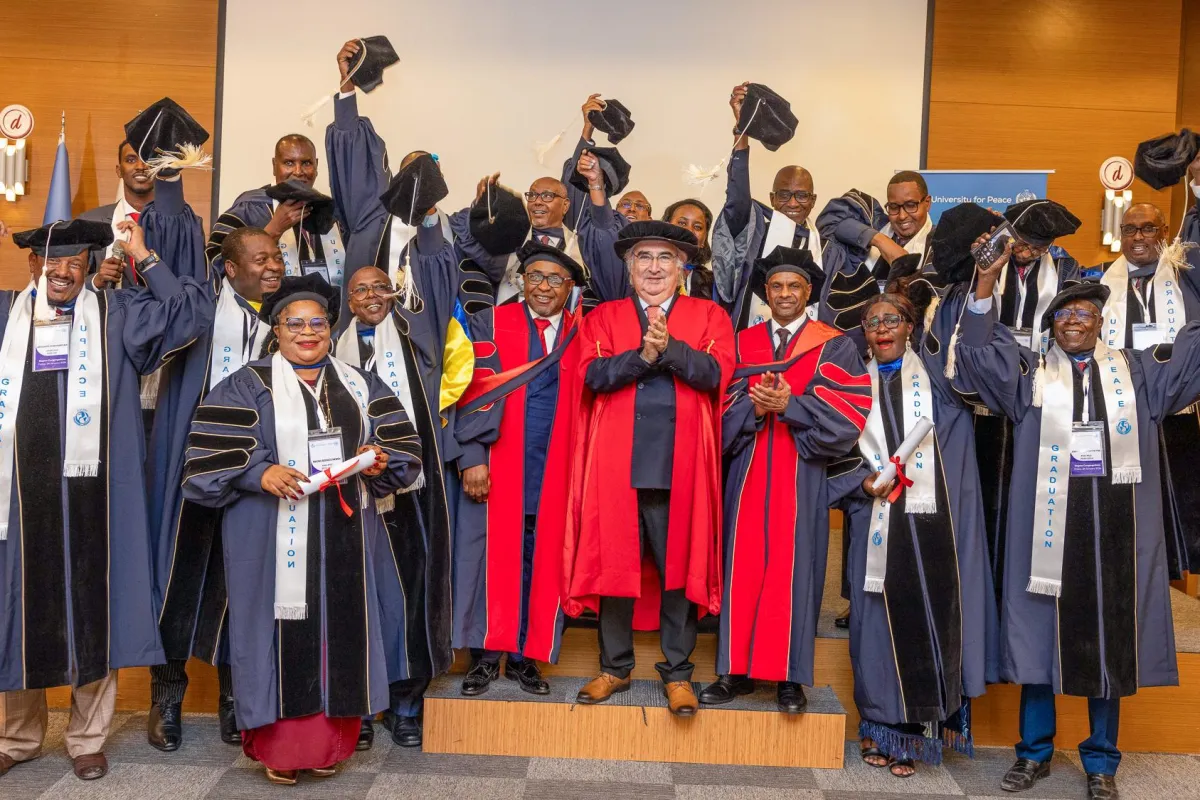 A group of graduates raise their mortarboards with UPEACE Senior officials at the fourth UPEACE graduation ceremony held in Mogadishu, Somalia, on 24 January 2025. A group of graduates raise their mortarboards with UPEACE Senior officials at the fourth UPEACE graduation ceremony held in Mogadishu, Somalia, on 24 January 2025.