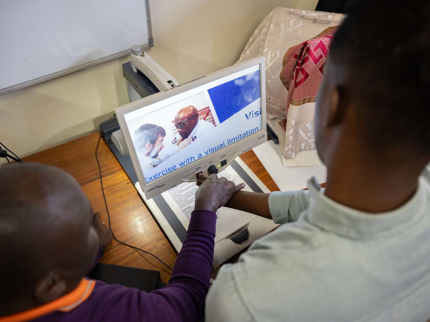 Abdirahman Mohamud Kulane, inspects one of the assistive tools during a week-long training on braille production and digital inclusion at KyU Hi-Techn Center in Kampala, Uganda. Photo of Abdirahman Mohamud Kulane, inspects one of the assistive tools during a week-long training on braille production and digital inclusion at KyU Hi-Techn Center in Kampala, Uganda.