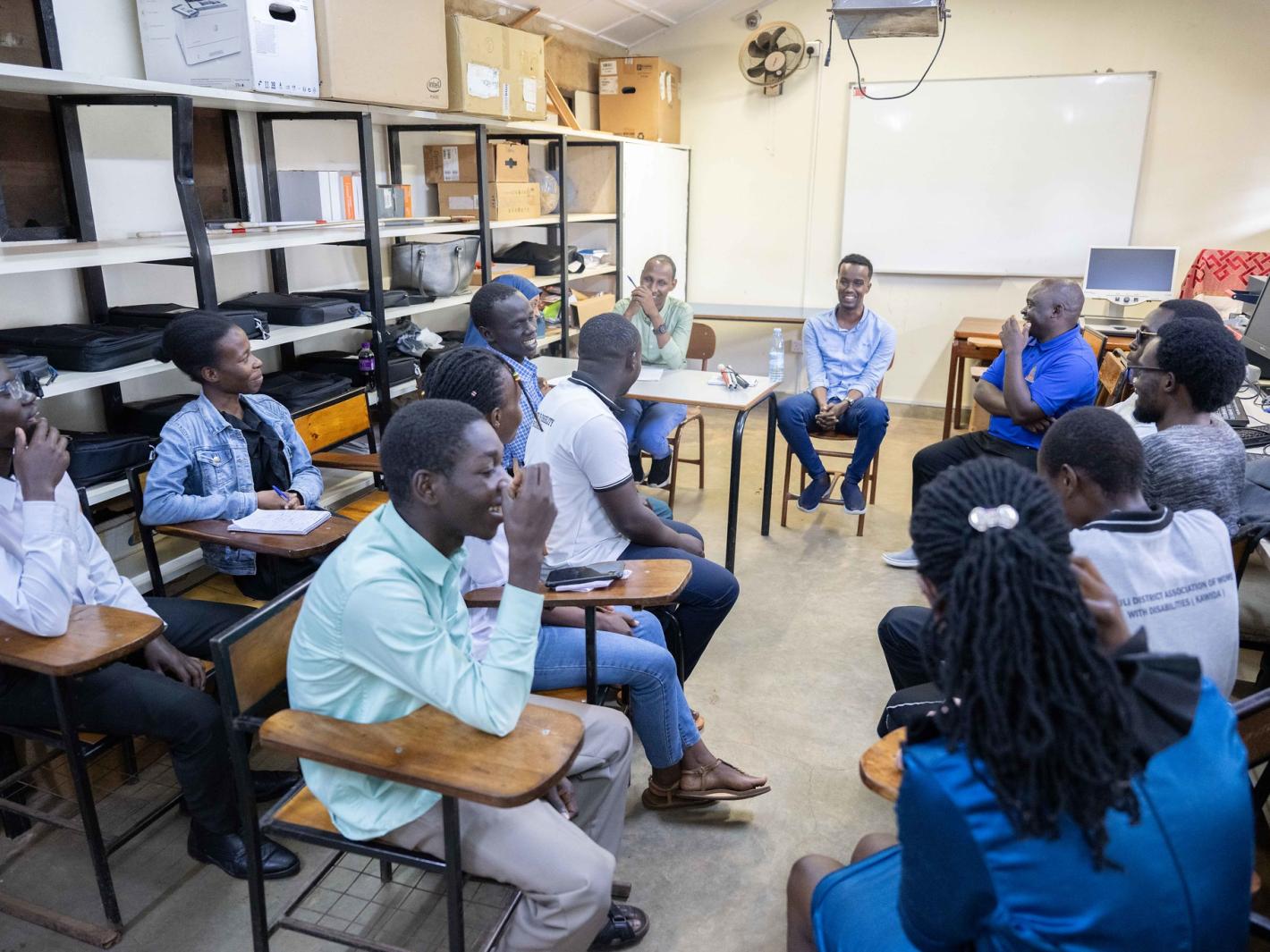 Photo of Abdirahman Mohamud Kulane speaks during a meeting with visually impaired students from KyU in Kampala, Uganda.