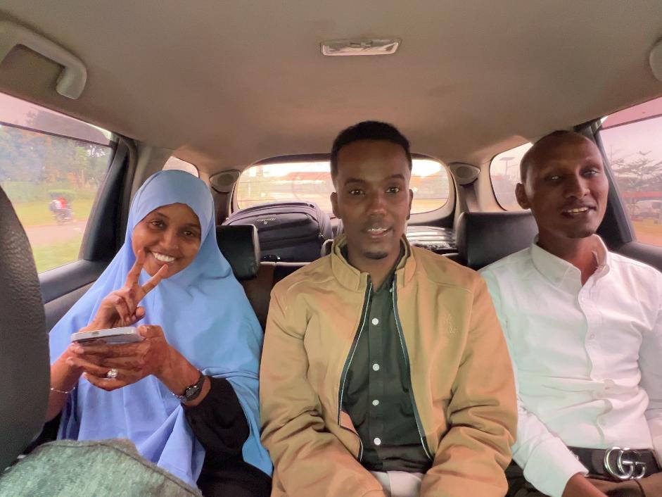 A photo of members of UDHAN team in a car arrive at Kampala to participate in a week-long training on braille production and digital inclusion.