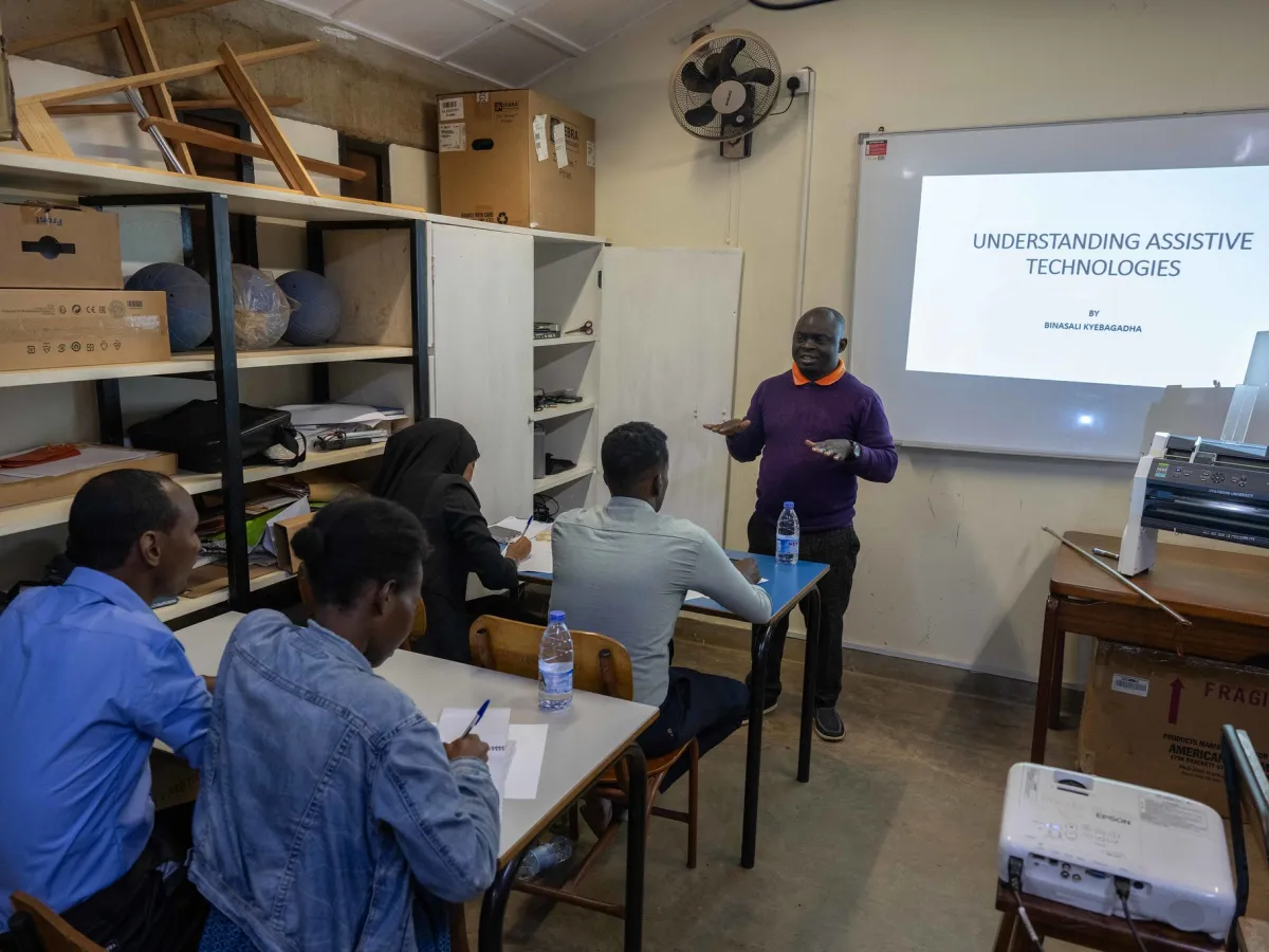 A photo of participants attend a training on braille production and digital inclusion at KyU Hi-Techn Center in Kampala, Uganda. A photo of participants attend a training on braille production and digital inclusion at KyU Hi-Techn Center in Kampala, Uganda.