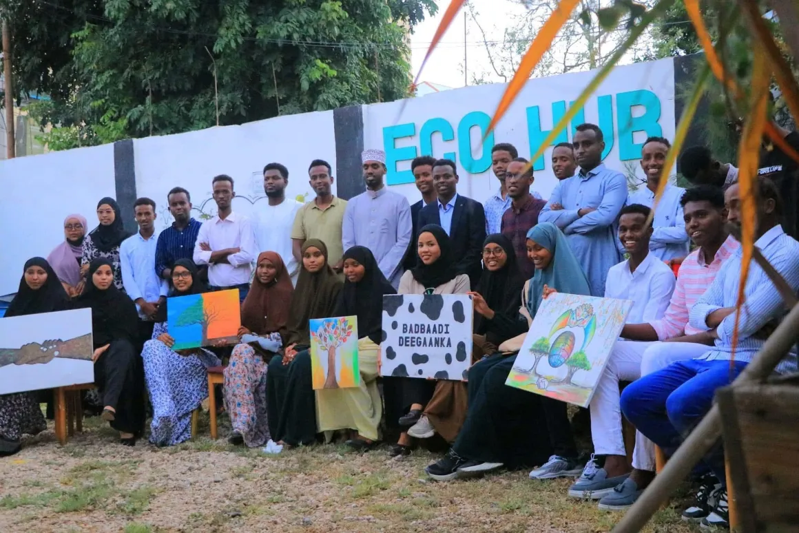Abdishakur Abdirahman poses with a group of people in front of Eco Hub Abdishakur Abdirahman poses with a group of people in front of Eco Hub