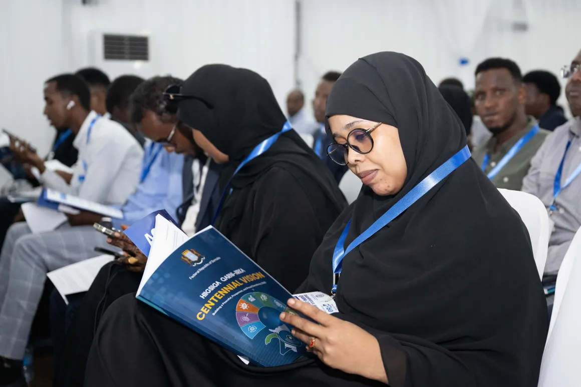 Attendee reading Centinal vision 2060
