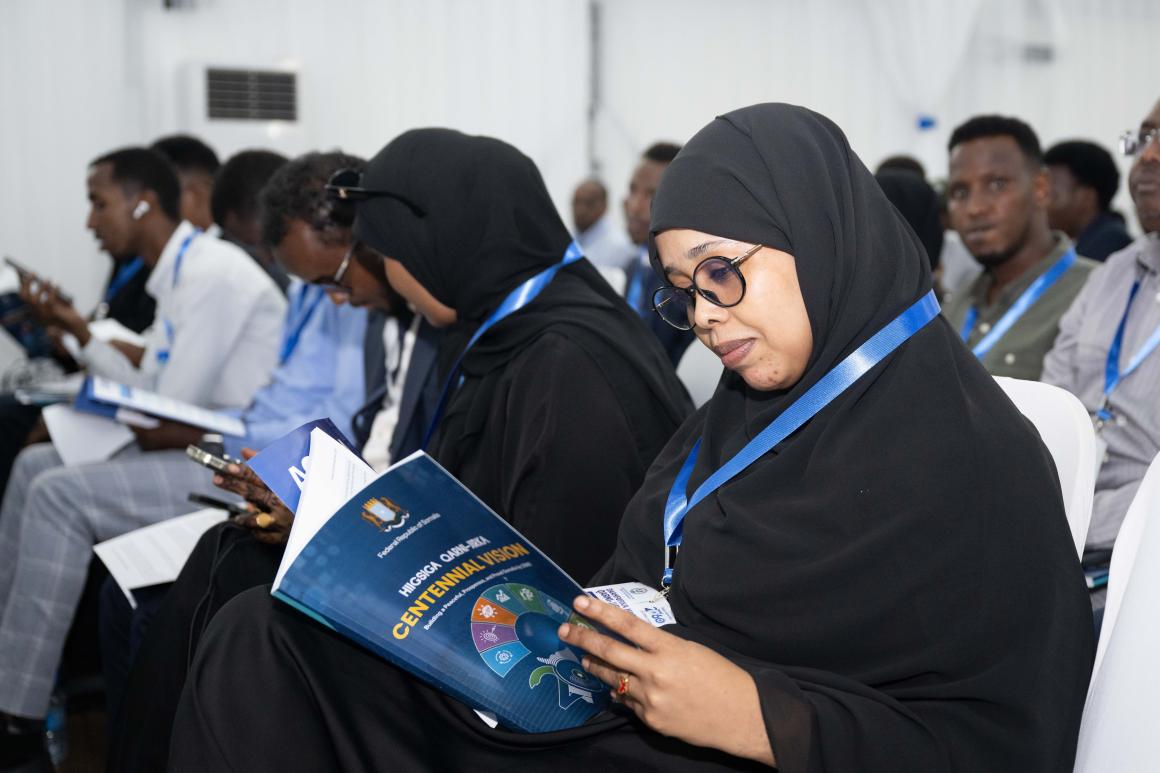 Attendee reading Centinal vision 2060